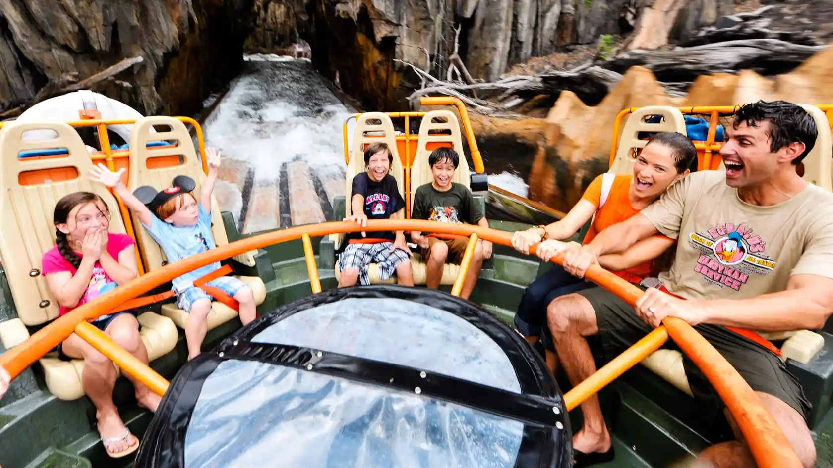 2 adults and 4 kids getting wet on Kali River Rapids