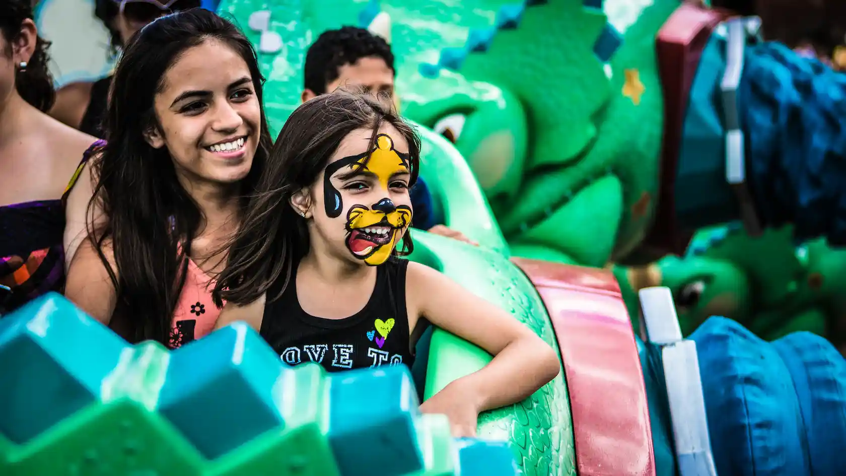 Mother and daughter ride TriceraTop Spin