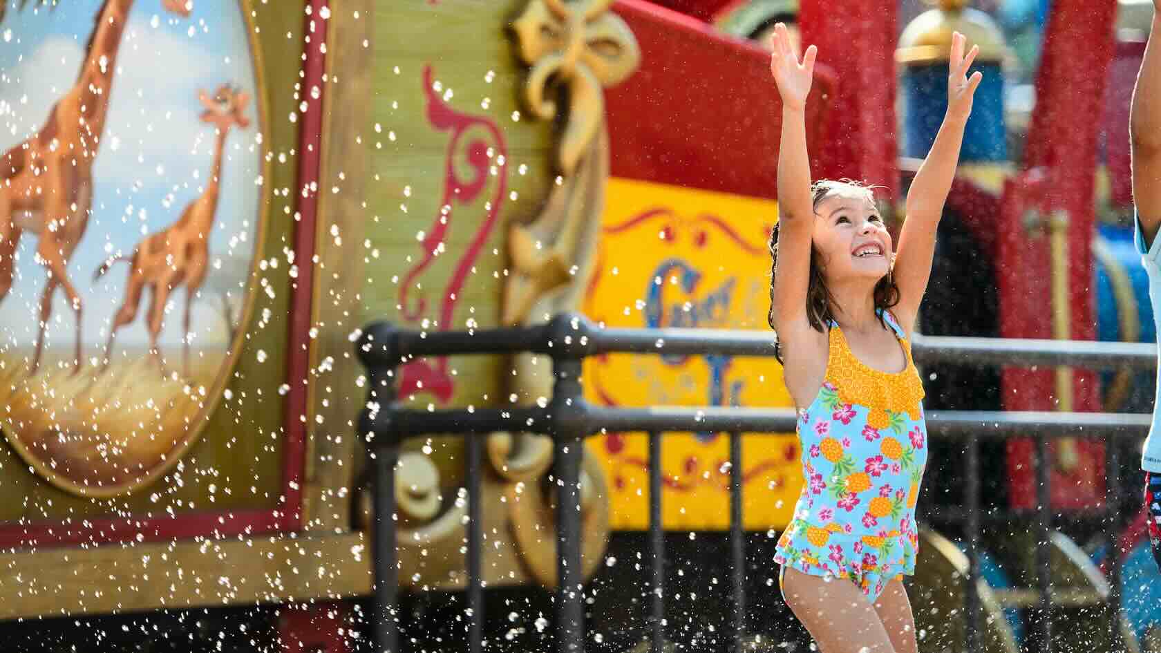 A little girl splashing in the water at Casey Jr's